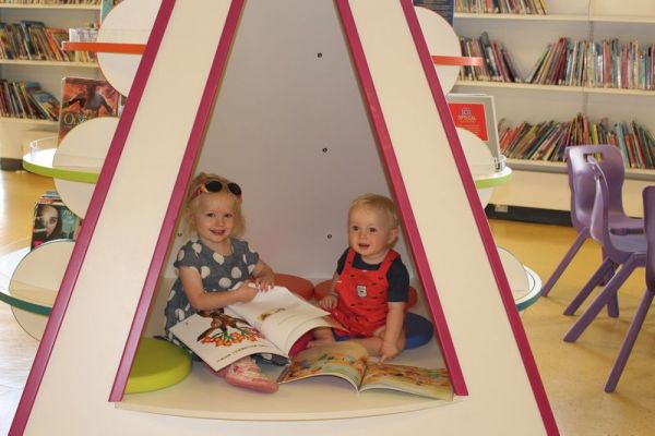 Forum Library - Children reading in teepee